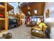 Living room with vaulted ceiling, skylights, and leather couches at 8806 Clear Creek Ct, Douglasville, GA 30135
