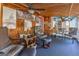 Relaxing sunroom with wood paneled walls and comfortable seating at 8806 Clear Creek Ct, Douglasville, GA 30135