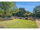 Expansive backyard featuring a refreshing pool, lush lawn, and inviting outdoor seating area at 600 English Ct, Mcdonough, GA 30252
