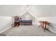 Cozy attic bedroom with gray carpet and a ceiling fan at 600 English Ct, Mcdonough, GA 30252