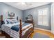 A nicely decorated bedroom offers a comfy bed and bright natural light at 600 English Ct, Mcdonough, GA 30252