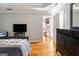 Bright bedroom with hardwood floors and access to another room at 600 English Ct, Mcdonough, GA 30252