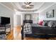 Well-lit bedroom featuring hardwood floors and a ceiling fan at 600 English Ct, Mcdonough, GA 30252