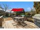 Deck with table, chairs, umbrella, and grill at 600 English Ct, Mcdonough, GA 30252