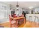 Eat-in kitchen features a breakfast bar and light fixture hanging above the dining table at 600 English Ct, Mcdonough, GA 30252