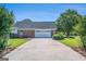 Spacious driveway leading to a two-car garage with ample parking space at 600 English Ct, Mcdonough, GA 30252