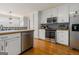 Bright kitchen with stainless appliances, white cabinetry, and wood countertops at 600 English Ct, Mcdonough, GA 30252