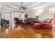 Expansive living room featuring gleaming hardwood floors and open layout at 600 English Ct, Mcdonough, GA 30252