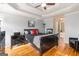 Spacious main bedroom boasts a trey ceiling, a ceiling fan, and an attached bathroom at 600 English Ct, Mcdonough, GA 30252