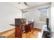 Study/Office displaying two windows and hardwood floors at 600 English Ct, Mcdonough, GA 30252