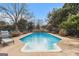 Inviting kidney-shaped pool with a tanning ledge at 600 English Ct, Mcdonough, GA 30252
