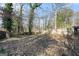 Large backyard with mature trees at 5546 Stoneybrook Se Ct, Mableton, GA 30126