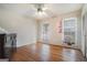 Bedroom featuring hardwood floors, a ceiling fan, and two windows at 5546 Stoneybrook Se Ct, Mableton, GA 30126