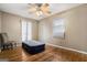 Bright bedroom with hardwood floors and a ceiling fan at 5546 Stoneybrook Se Ct, Mableton, GA 30126