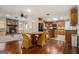 Kitchen with wood cabinets, breakfast bar, and stone fireplace at 5546 Stoneybrook Se Ct, Mableton, GA 30126