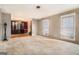 Large living room with hardwood floors and lots of natural light at 5546 Stoneybrook Se Ct, Mableton, GA 30126