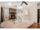 Living area features a stone fireplace, hardwood floors, and a glass top coffee table at 5546 Stoneybrook Se Ct, Mableton, GA 30126