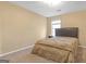 A cozy bedroom featuring neutral walls, a comfortable bed, and a bright window for natural light at 2618 Windage Sw Dr, Marietta, GA 30008