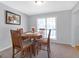 Traditional dining room with a round table, four chairs, neutral walls and lots of natural light at 2618 Windage Sw Dr, Marietta, GA 30008