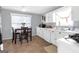 Bright kitchen with white cabinets, countertops and a window providing natural light above the sink at 2618 Windage Sw Dr, Marietta, GA 30008