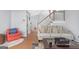 Cozy living room with hardwood floors, a comfortable couch, and open staircase at 2618 Windage Sw Dr, Marietta, GA 30008