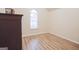 Bedroom with vaulted ceiling, wood floors, and large window at 4408 Idlewood Park, Lithonia, GA 30038