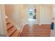 Bright and spacious entryway with wood-look floors and views to the kitchen at 4408 Idlewood Park, Lithonia, GA 30038