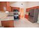 Modern kitchen with stainless steel appliances and wood cabinets at 4408 Idlewood Park, Lithonia, GA 30038