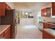 Kitchen with wood cabinets, stainless steel appliances, and tile floors at 4408 Idlewood Park, Lithonia, GA 30038