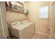 Laundry room with washer, dryer, and shelving at 4408 Idlewood Park, Lithonia, GA 30038