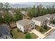 Aerial view of two story house, landscaped yard, and neighborhood at 430 St Annes Pl, Covington, GA 30016