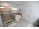 Main bathroom with shower, tub, and double vanity at 430 St Annes Pl, Covington, GA 30016