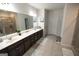 Bathroom with double vanity and dark brown cabinets at 430 St Annes Pl, Covington, GA 30016