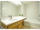 Bathroom boasts a vanity with quartz countertop and bathtub at 6527 Arbor Gate Sw Dr # Bldg 12, Mableton, GA 30126