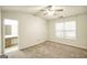 Bright bedroom with carpet, ceiling fan, and access to bathroom at 6527 Arbor Gate Sw Dr # Bldg 12, Mableton, GA 30126