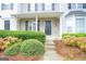 Townhouse exterior with a black front door and landscaping at 6527 Arbor Gate Sw Dr # Bldg 12, Mableton, GA 30126