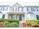 Two-story townhome with gray and white siding, black shutters, and landscaping at 6527 Arbor Gate Sw Dr # Bldg 12, Mableton, GA 30126