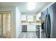 Updated kitchen with stainless steel appliances and white cabinets at 6527 Arbor Gate Sw Dr # Bldg 12, Mableton, GA 30126
