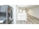 Modern kitchen features white cabinets, stainless steel appliances, and quartz countertops at 6527 Arbor Gate Sw Dr # Bldg 12, Mableton, GA 30126