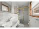 Simple bathroom with shower, sink and white tile at 200 Old Stagecoach Dr, Stockbridge, GA 30281