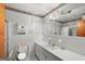 Clean bathroom with a toilet, sink, and shower, and classic white tile at 200 Old Stagecoach Dr, Stockbridge, GA 30281
