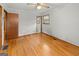 Hardwood floor bedroom with ceiling fan and access to the bathroom at 200 Old Stagecoach Dr, Stockbridge, GA 30281