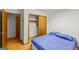 Simple bedroom with double bed, hardwood floors and a double door closet at 200 Old Stagecoach Dr, Stockbridge, GA 30281