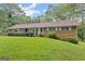 Front view of brick ranch house at 200 Old Stagecoach Dr, Stockbridge, GA 30281