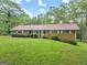 Ranch house with a green lawn at 200 Old Stagecoach Dr, Stockbridge, GA 30281