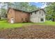 Brick house with attached garage and deck at 200 Old Stagecoach Dr, Stockbridge, GA 30281