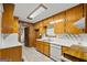 Galley kitchen with wood cabinets at 200 Old Stagecoach Dr, Stockbridge, GA 30281