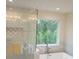 Elegant bathroom with a large shower, soaking tub, and chandelier at 4417 Meadowwood Dr, Loganville, GA 30052