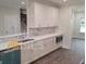 Modern kitchen with white cabinets and quartz countertops at 4417 Meadowwood Dr, Loganville, GA 30052