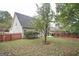 Spacious backyard with a wooden fence at 308 Royal Crescent Way, Stockbridge, GA 30281